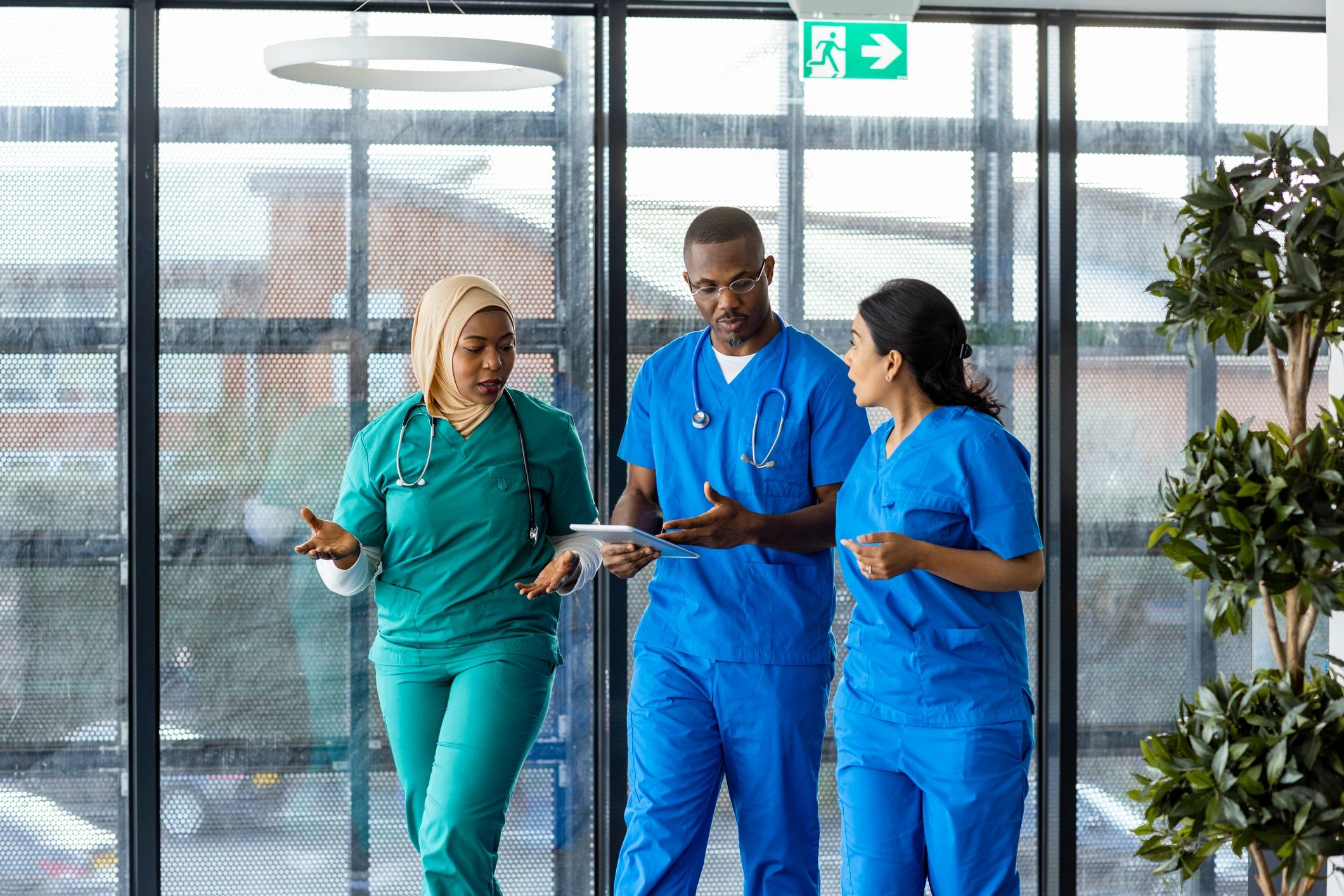Healthcare team walking through a hospital corridor