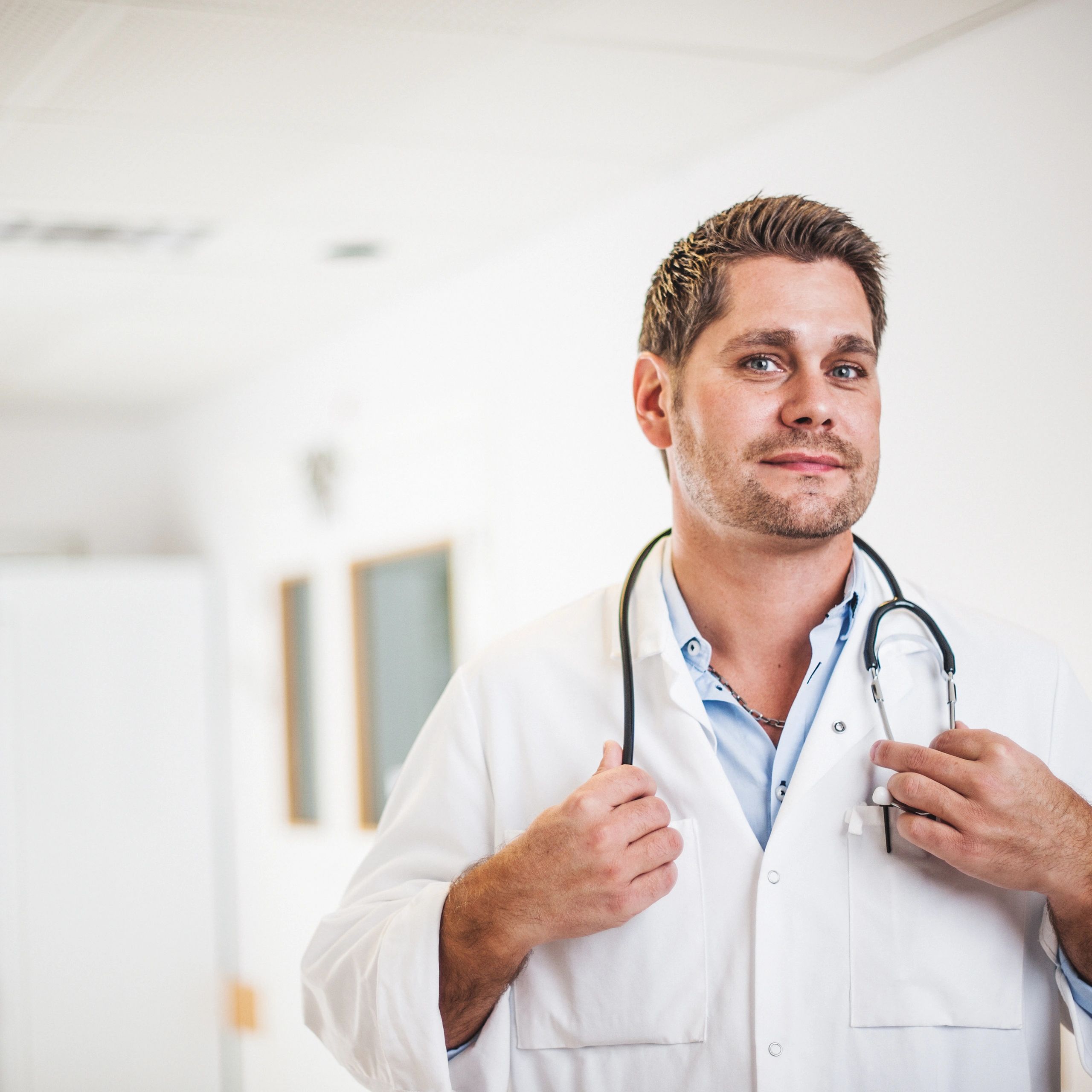 Portrait of a doctor in a hospital corridor for testimonial